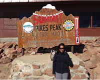 Sunetra Das stands at the summit of Pike's Peak in Colorado Springs, Colorado.